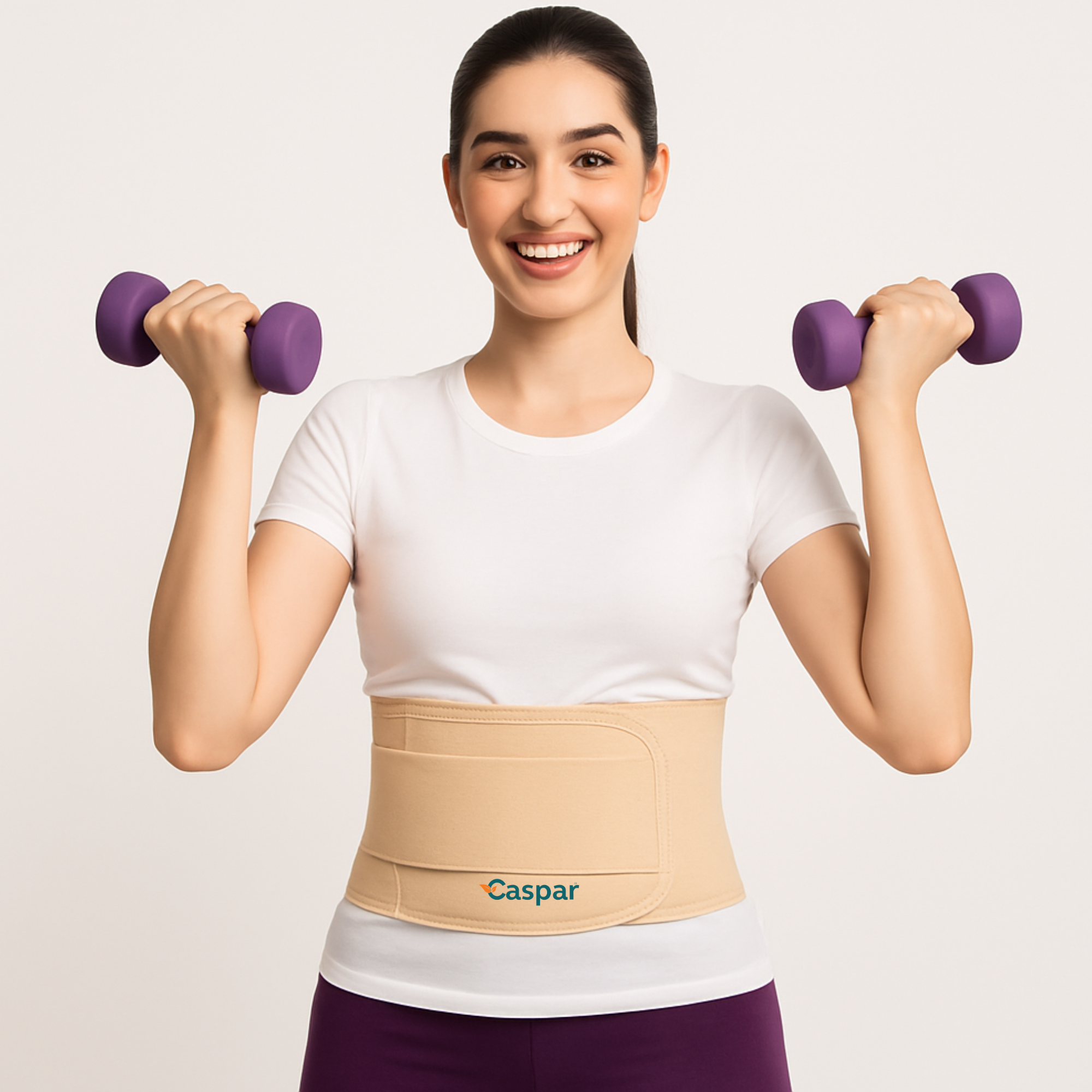 Woman lifting light dumbbells while wearing the CASPAR maternity support belt